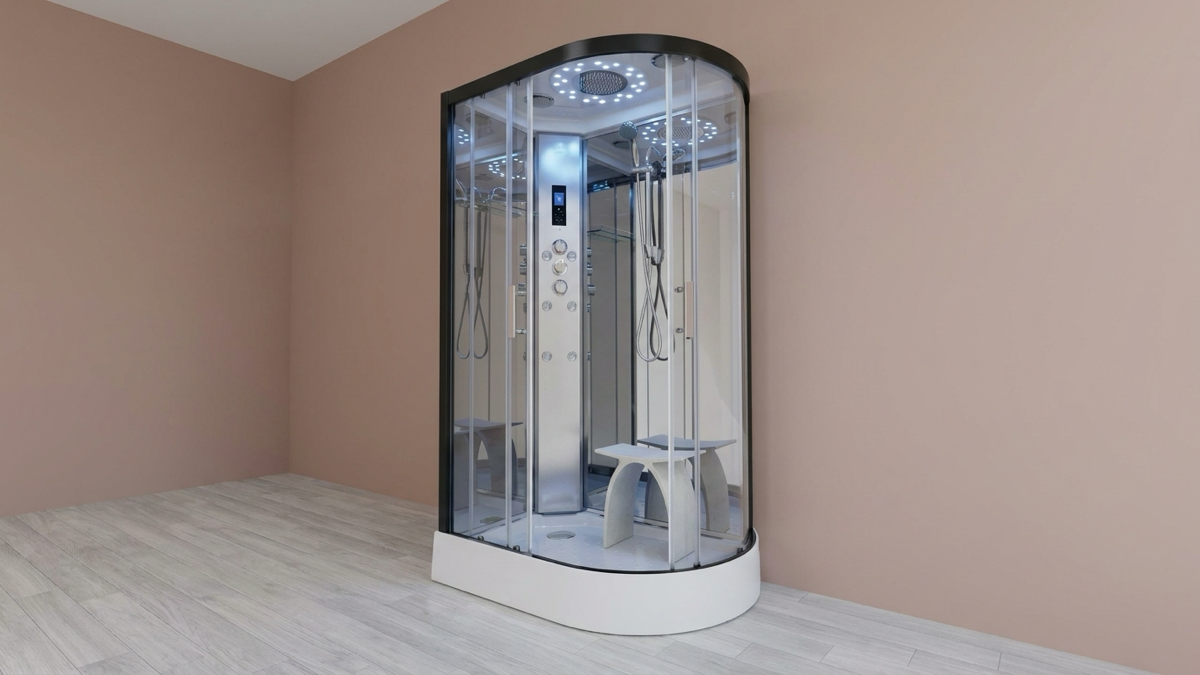 An Insignia 1200 Offset Platinum steam shower, black frame with clear glass showing the control column, jets and twin bench seats, standing in an empty, naturally lit room with a dusty clay-pink wall and pale ash-grey wood floor, styled for a sizing buying-guide feature rather than a product listing.